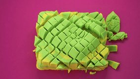 Very Satisfying and Relaxing Kinetic Sand ASMR. Cutting anti stress macro close up colorful Kinetic Sand with a Knife