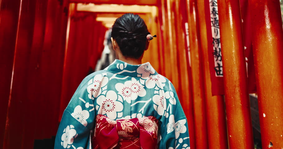 Back, Japanese woman and walking at temple for culture, religion and worship in Tokyo. Lady, kimono fashion and traditional clothes to enter spiritual shinto building for faith, heritage and history