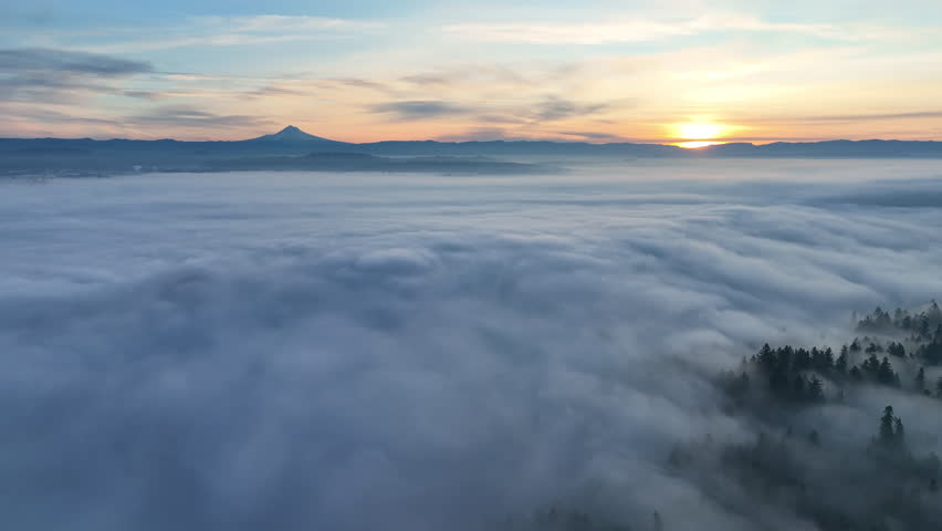 With Mt. Hood in the distance, dense fog covers the Willamette Valley in Oregon, not far south of Portland. This Pacific Northwest region is known for its beautiful forests and wet weather.
