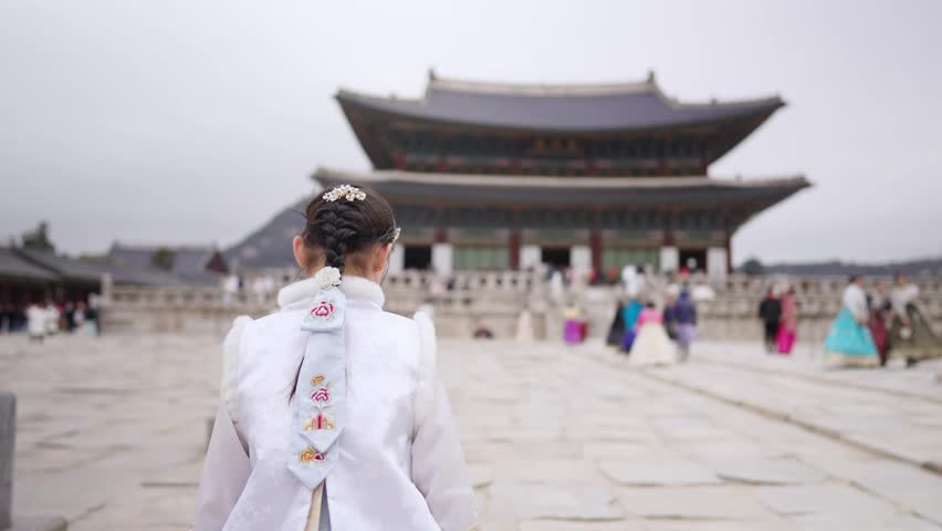 Slow-motion video of a Korean girl wearing Chimachogori at Gyeongbokgung Palace in Seoul, South Korea Royalty-Free Stock Footage #3413332705
