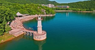 Aerial video of the lighthouse landscape by the lake. Drone surround shooting. Xin'anjiang Reservoir natural landscape in Hangzhou. 