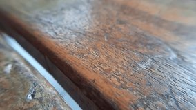 Broll video clip of wooden bench visible in detail with a macro lens