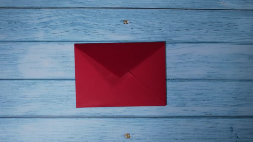 Opening making envelope with card for Valentines Day. Text YOU WON MY HEART and tic tac toe game Postcard craft, greeting card. Handmade card gift with your own hands.