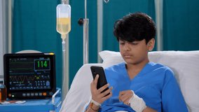 A sick young boy is talking on a video call while he is in the hospital - distant communication, bored in hospital. A teenage boy  a school student is admitted to the hospital with a hand injury -...