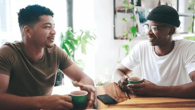 Happy couple of friends, talking at coffee shop and conversation, networking or social hangout at startup cafe. Young people, african students or customer with latte at small business or a restaurant - Powered by Shutterstock - Get 15% off with code: PIKWIZARD15