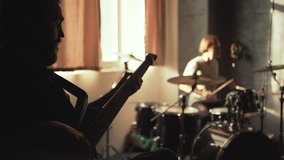 Musicians rehearsing in sound recording studio. Music band repetition - Powered by Shutterstock - Get 15% off with code: PIKWIZARD15