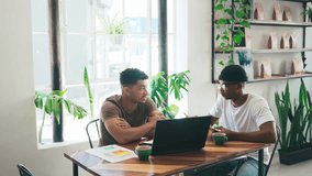 Business people, laptop and coffee shop meeting, planning and documents for startup ideas, sales or data analysis. Young entrepreneur or friends at a cafe or restaurant with computer for remote work - Powered by Shutterstock - Get 15% off with code: PIKWIZARD15