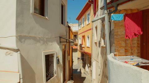 Climbing down an old picturesque typical street in the city of Kavala, Greece. Kavala is the main seaport of eastern Macedonia