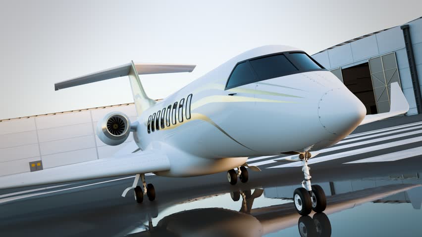 A sophisticated private jet stands ready on the tarmac embraced by the warm hues of twilight. Its polished surface gleams alongside the terminal, poised for an exclusive voyage.