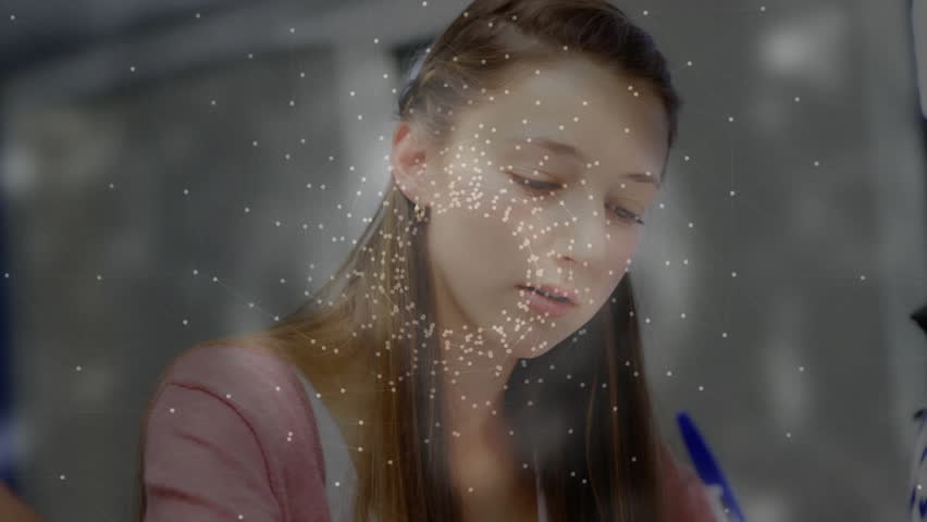 Animation of network of connections and globe over diverse schoolchildren writing. Technology, education and digital interface concept, digitally generated video. - Powered by Shutterstock - Get 15% off with code: PIKWIZARD15