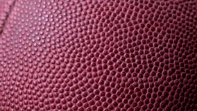 Cinematic close-up of a football, a versatile clip for various sports projects