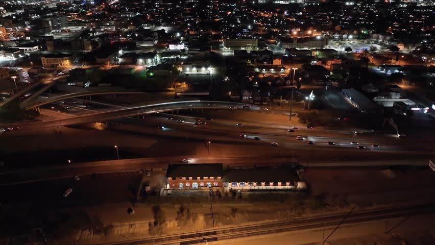 Freeway in El Paso, Texas at night with traffic moving and stable drone video.