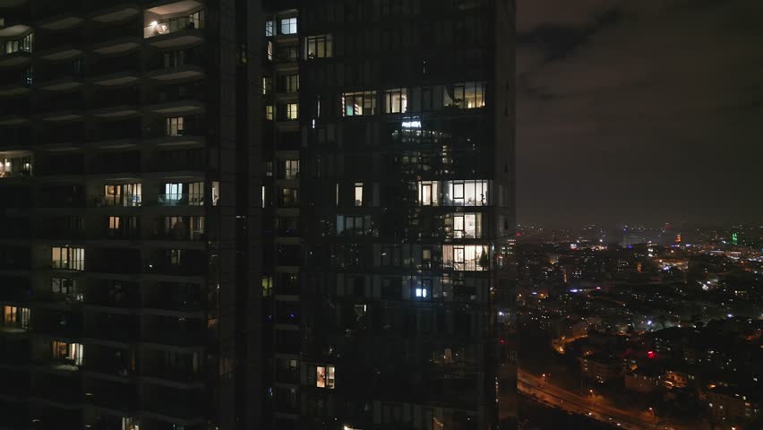 Istanbul's glass and concrete skyscrapers, home to offices, hotels, and residential complexes at night. Aerial drone view Royalty-Free Stock Footage #3413800601