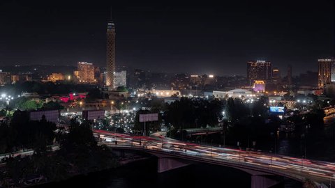 Egypt, Cairo - July 10 2023: Night timelapse of traffic on the 8th October Bridge in central Cairo Adlı Haber Amaçlı Stok Video