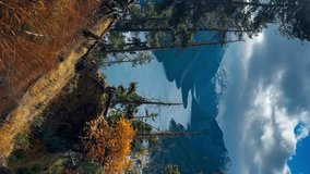  Plansee lake among snow-capped mountains in Tyrolean Alps, Austria late autumn in cloudy weather. Vertical video. High quality 4k footage - Powered by Shutterstock - Get 15% off with code: PIKWIZARD15