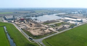 Harlingen Industrial Port with Factory and Sand Piles, Following Truck – Friesland, The Netherlands, 4K Drone Footage