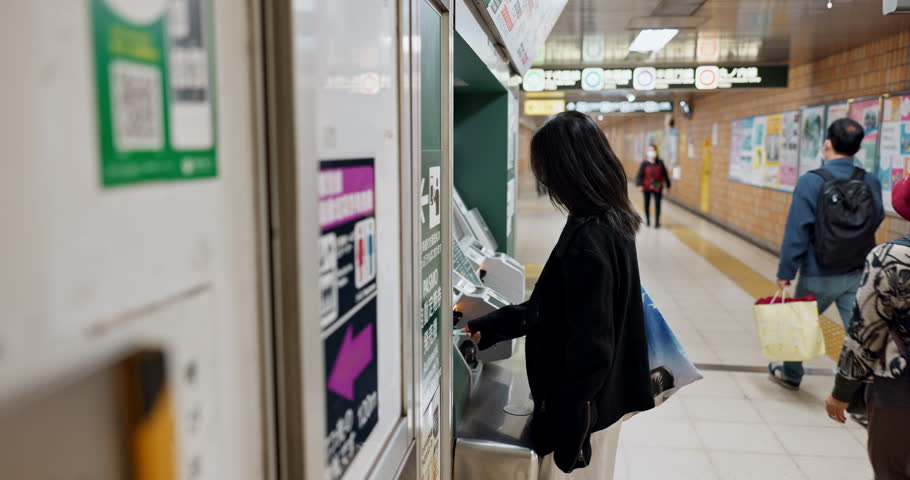 Woman, ATM and bank with card for money, click or press buttons for option, choice and decision in Tokyo. Japanese person, girl and machine for banking service, cash and walking with bag on travel