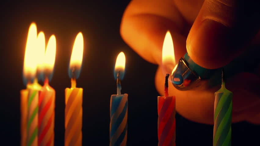 Birthday Cake Candles Are Lit Closeup

