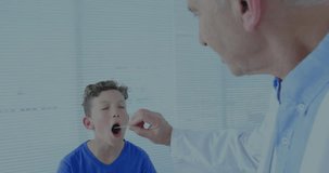 Animation of data processing over caucasian male doctor and boy patient in hospital. Medicine, healthcare, hospital, computing and digital interface concept digitally generated video.