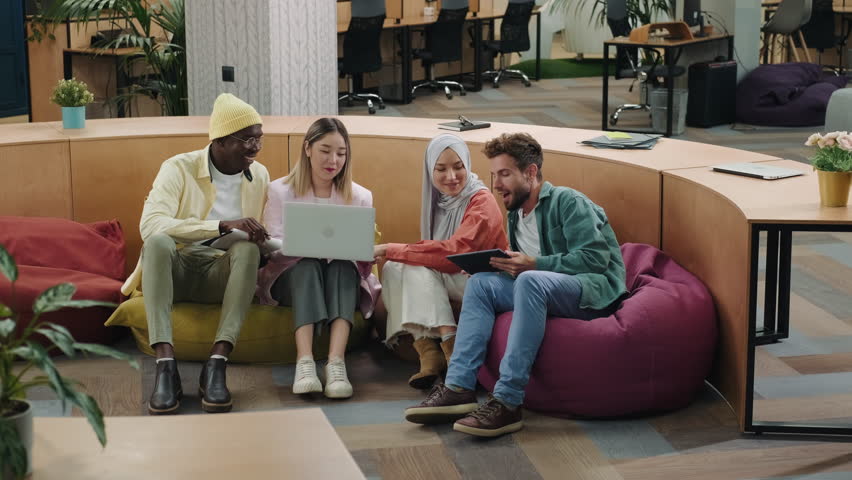 Multiethnic creative business team working on a project in the modern office.Diverse People,Business Partners,Asian Female,Caucasian man,Muslim Businesswoman,African American Businessman