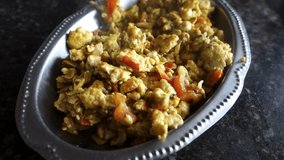 Cinematic Close-Up: Spicy Indian Egg Bhurji Recipe - Scrambled Eggs with Tomatoes and Onions.