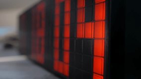 close-up of the dial of an electronic watch on which the numbers change. Red digits of an electronic pixel table clock. - Powered by Shutterstock - Get 15% off with code: PIKWIZARD15