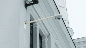 Office premises monitoring: CCTV camera securely mounted on a wall