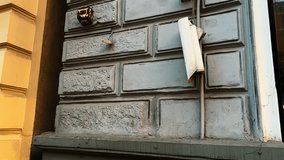Building surveillance: Broken CCTV camera mounted on an office wall