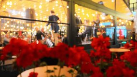 Vibrant restaurant atmosphere: Defocused scene with live band on stage