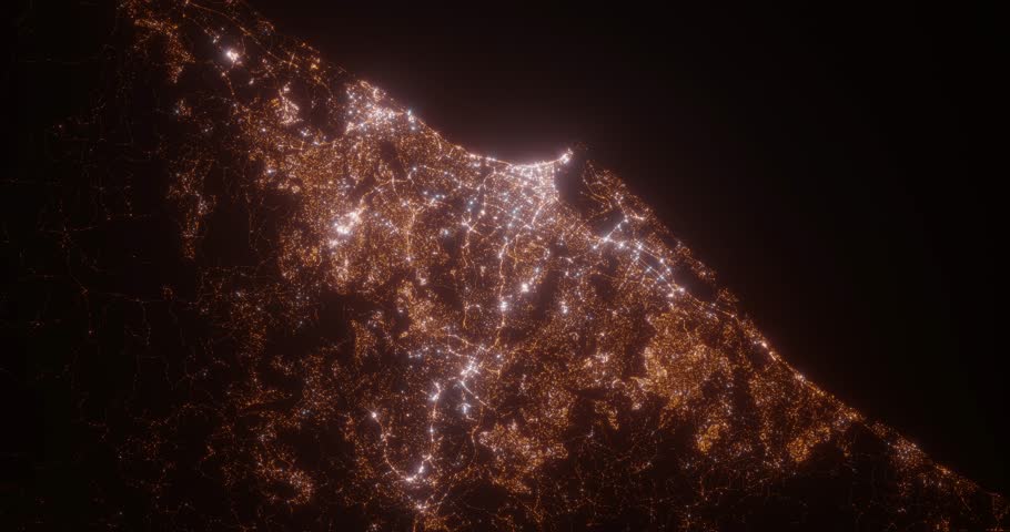 Durban (South Africa) aerial view at night. Top view on modern city with street lights. Camera is zooming out, rotating clockwise. Vertical video. The north is on the left side