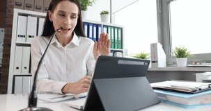 Woman talking on video call with colleagues in office closeup. Video conference and online job interview concept