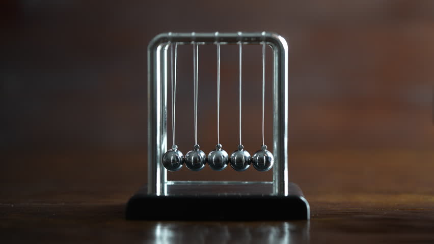 Metal Newton cradle placed on wooden background as representation of momentum concept, cradle balance steel balls, school teaching supplies, desk toy, gifts home decoration Royalty-Free Stock Footage #3414558429