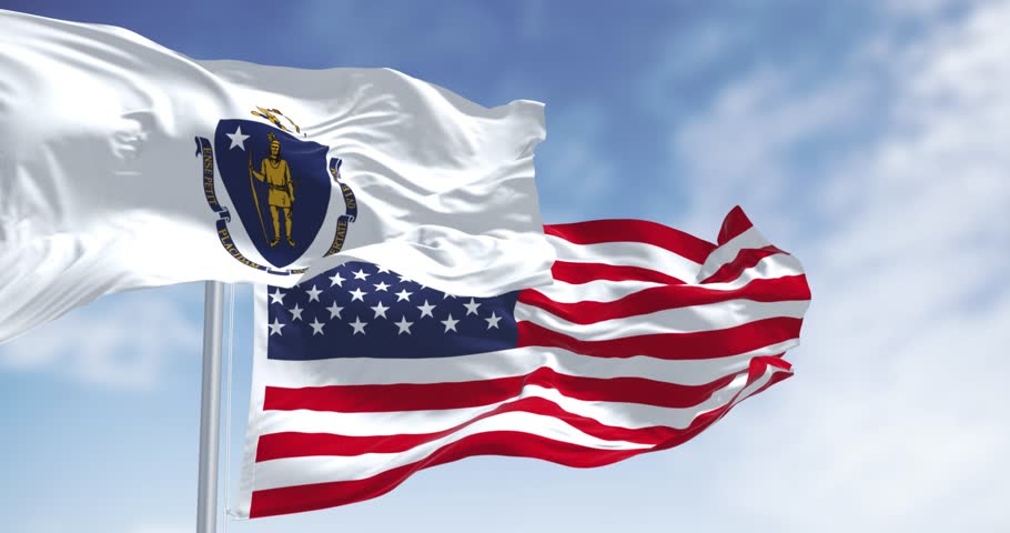 The flags of Massachusetts and the United States waving in the wind on a clear day. Patriotism and identity concept. Seamless 3d render animation. Slow motion loop. Selective focus