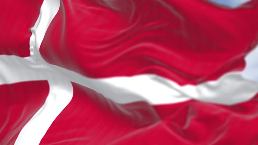 Close-up of Denmark national flag waving on a clear day. Red flag with a white Scandinavian cross extending to the edge of the flag. Seamless 3d render animation. Slow motion loop. Selective focus