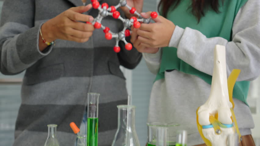 asian kids or students holding molecular structure model for studying biology in laboratory class - Powered by Shutterstock - Get 15% off with code: PIKWIZARD15