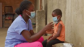vaccine against virus injection in children of africa , medical treatment nurse doctor wearing mask  - Powered by Shutterstock - Get 15% off with code: PIKWIZARD15
