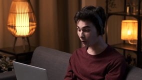 Amazed Caucasian Man Using Laptop on Living Room Sofa - Powered by Shutterstock - Get 15% off with code: PIKWIZARD15