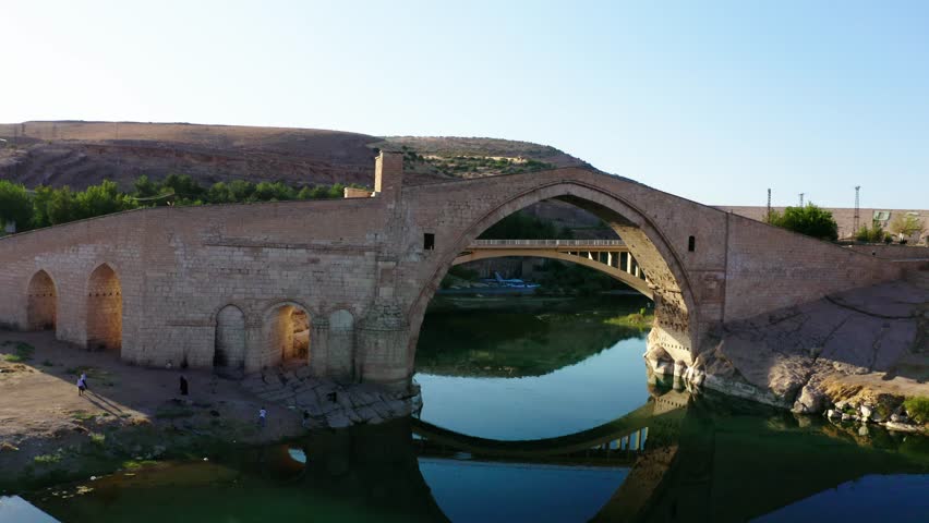 Ancient bridge over the lake, Malabadi bridge, Anatolia, 4K drone footage