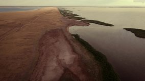 Scary videos of the green and yellow river with the red desert around it. Drone video of the environmental disaster
