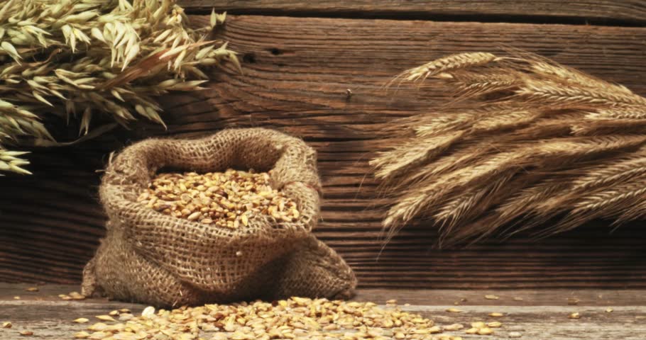 Closeup of buns with multi grains on wooden table. Parallax effect.