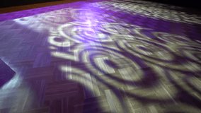  parquet floor with patterns of purple light and shadows, likely from a stained glass window or colored light source - Powered by Shutterstock - Get 15% off with code: PIKWIZARD15