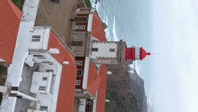 Aerial view of lighthouse at Cape Roca (Cabo da Roca) - the westernmost point of continental Europe, Portugal. Drone flying over Atlantic ocean shores beautiful archipelagos natural scenery