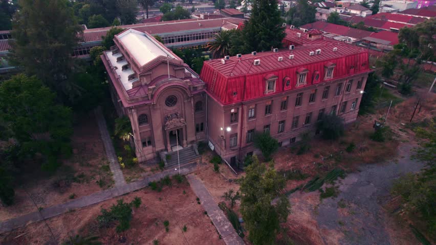 Aerial view dolly in at the medical school of the south campus of the University of Chile in Santiago - Old architecture
