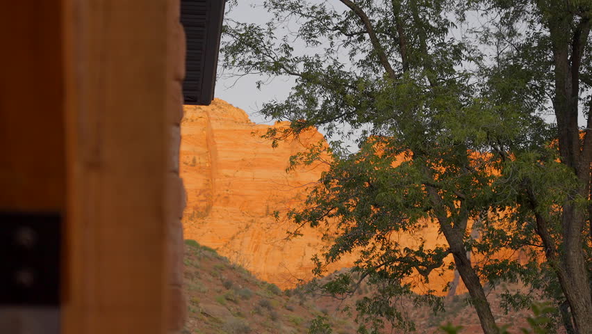 Establishing shot of mountains with red rocks in Grotto Road, Zion National Park, Utah, North America. Day time. ProRes 422 HQ.