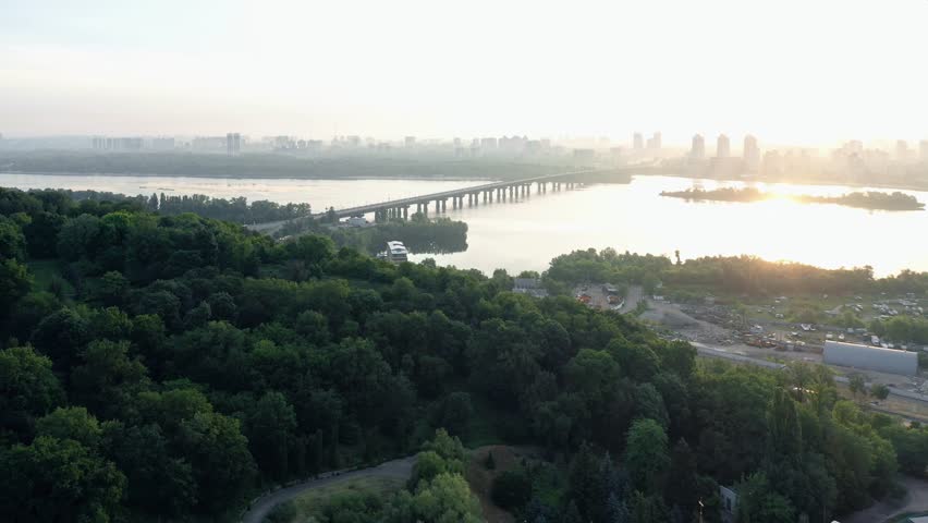Scenic morning view of Christian church on the background of green park and Dnipro river. Panoramic view of Kiev, Ukraine.