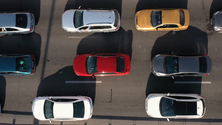 Top view from above to the road traffic. Traffic jam at a highway junction. Aerial drone view of freeway busy city rush hour. Royalty-Free Stock Footage #3415570509