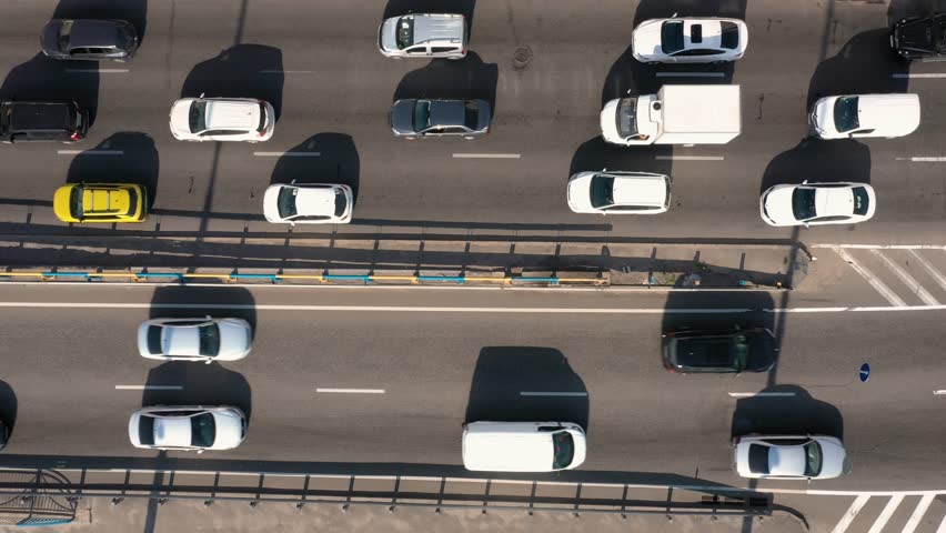 Traffic jam with a lot of cars on a highway. Aerial view from above. Urban city rush hour. Royalty-Free Stock Footage #3415572547