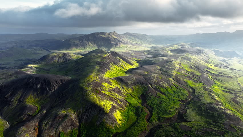 Enchanting moss-covered mountains in Iceland. Highlands in summer during sunset.