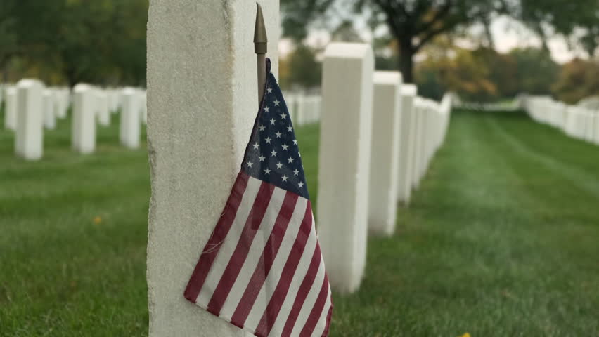 members graves with American flags at sunset in the National Cemetery. Unknown soldier grave. Veteran cemetery and U.S. flag. Military Appreciation Holidays concept Royalty-Free Stock Footage #3415698313