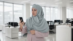 Muslim businesswoman talking on video call